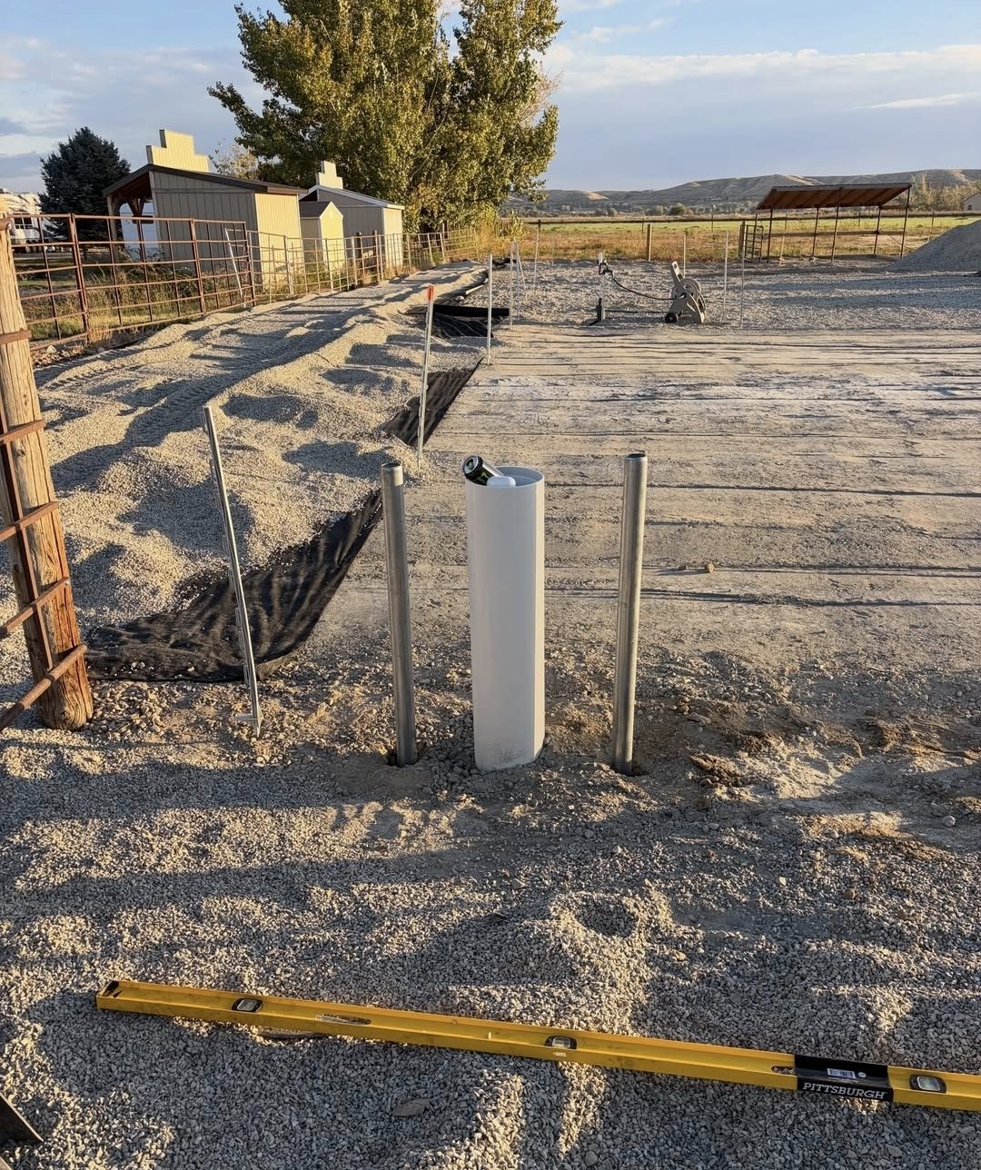 New fence posts set in gravel